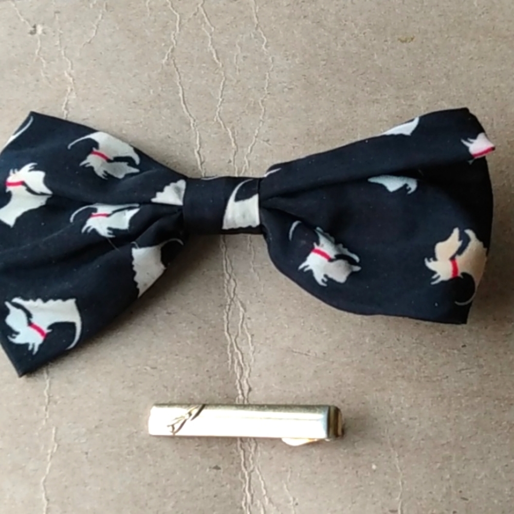So I have a bow and a clip for your hair and the bow has little puppies on it.